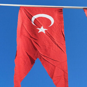 Turkish penants hanging above by @enginakyurt on Pexels