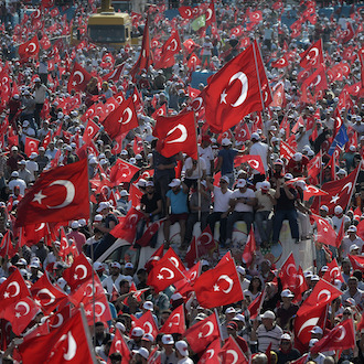 People wave Turkish flags during a rally to protest the failed coup attempt at 15th July 2016 and mourn the 240 killed people