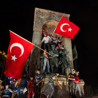 People waving Turkish flags in night protests after a failed coup attempt in July 2016