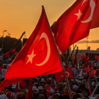 Crowds gathered with Turkish flags unfurled at sunset in İstanbul, Turkey on 07.15.2017 for a military coup and protest meeting