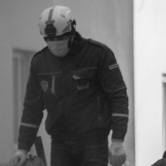 Masked rescue workers searching through rubble in Adana, Turkey, on 8 February 2023