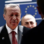 President Erdogan arrives at the European Council building in Brussels flanked by security