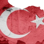 Turkish flag overlayed on the country map and Euro coin background