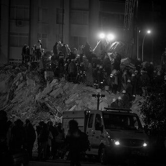 Turkey earthquake rescue workers working by searchlight into the night in Adana, Turkey, on 10 February 2023